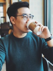 asian man in glasses drinking coffee | 5 Steps to Set-Up a Night Routine That Really Works