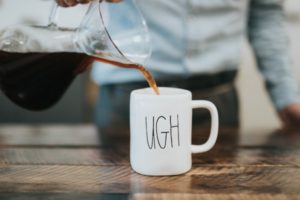 man pouring coffee into a mug that says ugh | Make Good Mornings: How to Master Your A.M. Routine