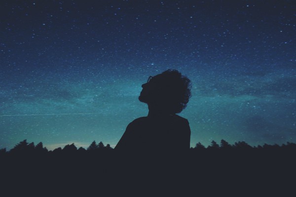 silhouette of man looking at stars | How to Define Mindfulness and 3 Ways to Try It