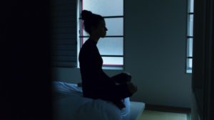 silhouette of woman meditating on bed | 5 Steps to Set-Up a Night Routine That Really Works