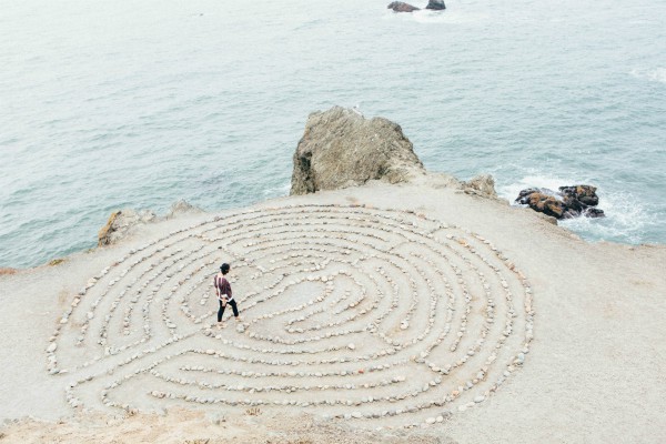 woman walking into sand maze on beach | How to Define Mindfulness and 3 Ways to Try It