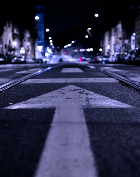 arrow on street at night | 7 Quotes About Goals that Will Keep You Moving