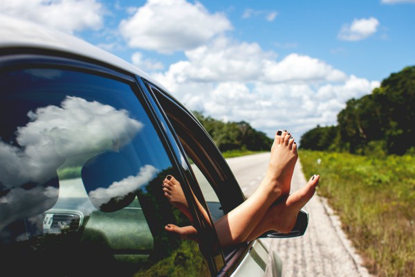 bare feet outside of car window in the summer | 3 Habits of Happy People You Should Borrow