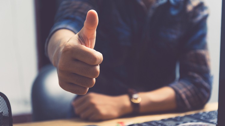 close up of business man giving thumbs-up | 7 Positive Quotes to Get You Through the Day https://positiveroutines.com/quotes-to-get-you-through-the-day/