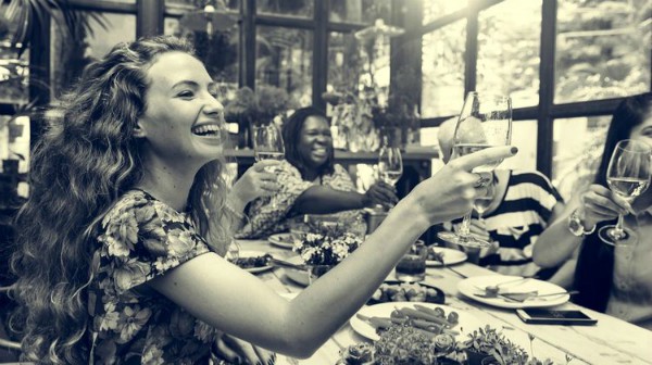 happy women around table cheers | How to Change Habits: 23 Ways to Transform