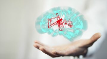 mans hand holding brain with bad habits in it | How to Break Bad Habits, According to Research https://positiveroutines.com/how-to-break-bad-habits/ ‎