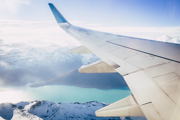 plane wing over mountains and water | How to Define Gratitude + Have a Better Holiday Season  https://positiveroutines.com/define-gratitude/