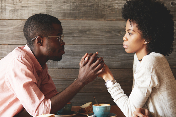 black man and woman talking over coffee forgiveness | Simple Acts of Kindness to Try This Valentine's Day