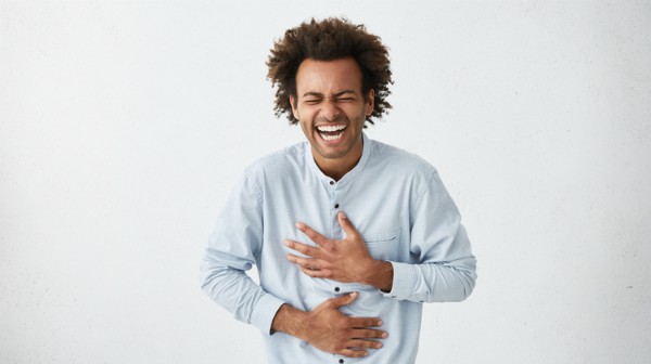 black man laughing holding stomach | 54 Ways to Be Happy That Will Reverse the Winter Blues https://positiveroutines.com/ways-to-be-happy/ ‎