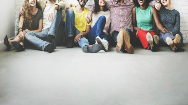 diverse people sitting against wall laughing | 54 Ways to Be Happy That Will Reverse the Winter Blues https://positiveroutines.com/ways-to-be-happy/ ‎