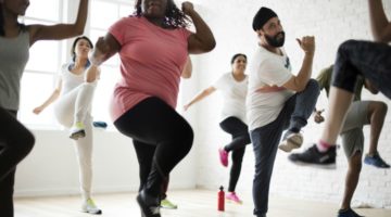 group of diverse people exercising together reducing stress | 1 Simple, Science-Backed Secret for Reducing Stress