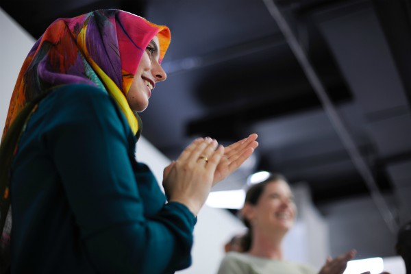 muslim woman rainbow headscarf clapping at work | How to Get Rid of the Sunday Scaries, For Good