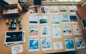 polaroid photos on cork board | Why Sleep is Key to Increasing Productivity