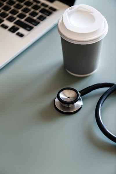 coffee cup and stethoscope | Make the Power of Kindness Work for You