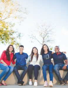 diverse group of people outside smiling | Make the Power of Kindness Work for You