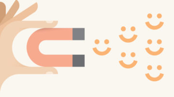 illustration of hand holding magnet attracting positivity smiles | Top 5 Insights from the World Happiness Report 2018