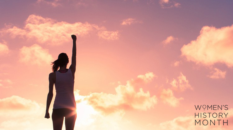 woman in front of sunset fist up power | 14 Quotes by Women to Inspire and Motivate You