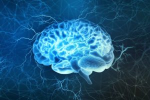 human brain surrounded by blue electric currents | What You Need to Know about Stress and the Brain