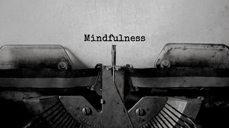 word mindfulness typed on vintage typewriter | 26 Ways to Make Practicing Mindfulness Part of Your Day