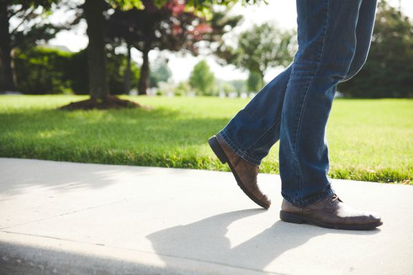 close up of man's legs walking outside | How to Improve Productivity in the Workplace and Beyond