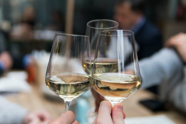 three people clinking wine glasses | 10 Expert-Approved Gratitude Messages for Mom