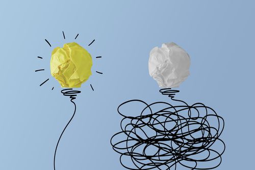 two lightbulb images one cluttered and not lit one lit | How to Improve Productivity in the Workplace and Beyond