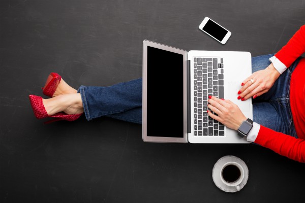 woman sitting on floor in red heels with laptop | 72 Resources to Overcome Procrastination and Improve Productivity https://positiveroutines.com/overcome-procrastination-resources/ 