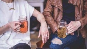 two women drinking tea from mason jars | 3 Expert Secrets to Relationship Building https://positiveroutines.com/relationship-building-secrets/
