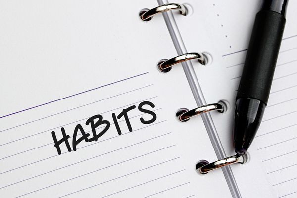 HABITS word written on notebook | 75 Great Apps That Will Change Your Life https://positiveroutines.com/great-apps-for-change/ 