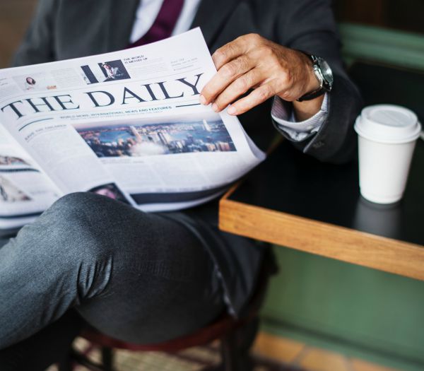 businessman reading newspaper | 5 Productivity Hacks for Ultimate Email Efficiency https://positiveroutines.com/productivity-hacks-email/ ‎