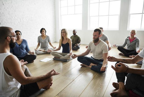 diverse people attending guided meditation class | Why You Need to Try Loving-Kindness Meditation https://positiveroutines.com/loving-kindness-meditation/