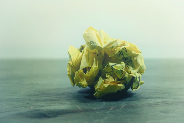 yellow ball of paper crumpled up | Can a Productivity App Teach You How to Be More Organized? https://positiveroutines.com/how-to-be-more-organized-app/