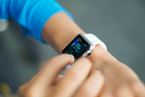 hand checking apple watch | One of the Best Benefits of Napping? Increased Productivity https://positiveroutines.com/productivity-benefits-of-napping/