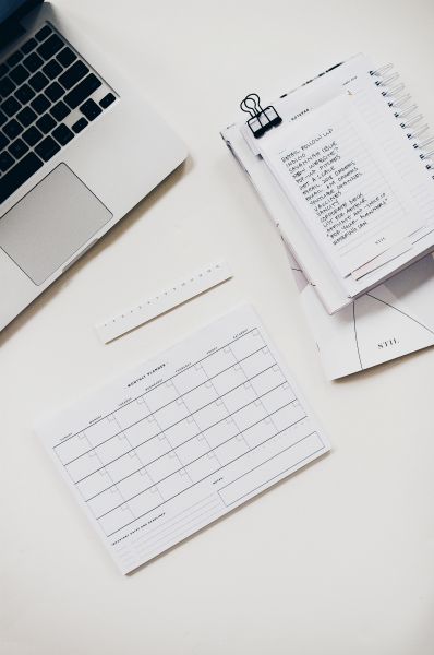 planner and calendar on white background | The Best Decluttering Tips for a Productive Workspace https://positiveroutines.com/decluttering-tips/