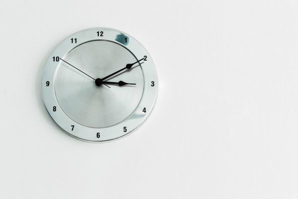 silver clock on white wall | Yes, You Can Stop Procrastinating. Here's How. https://positiveroutines.com/stop-procrastinating/