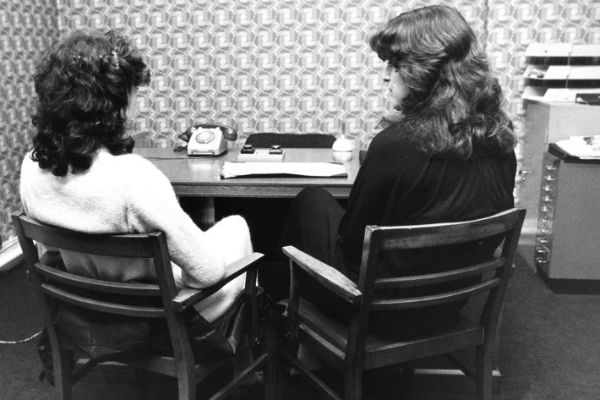 vintage photo of two women in office | 59 Work Tips to Be Better At Your Job  https://positiveroutines.com/best-work-tips/