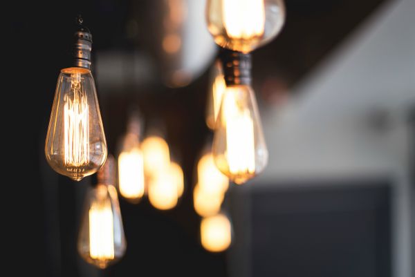 lightbulbs and filaments hanging from ceiling | Why is Finding Meaning In Life and Work So Important? https://positiveroutines.com/finding-meaning/ 