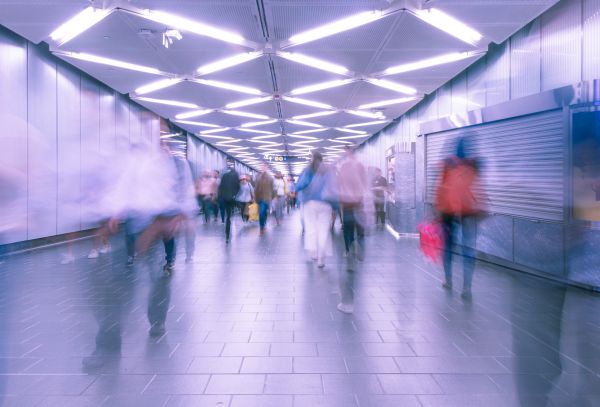 blurry picture of people walking in subway | How to Make the Most of Your Commute to Work https://positiveroutines.com/commute-to-work-tips/