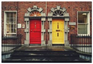 brick building with one red door one yellow door choice concept | In Time for the Holidays: How to Take Breaks Effectively  https://positiveroutines.com/how-to-take-breaks/