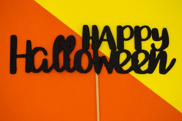 happy halloween against orange and yellow background | 11 Clever Halloween Costumes for the Productivity Obsessed  https://positiveroutines.com/clever-halloween-costumes/