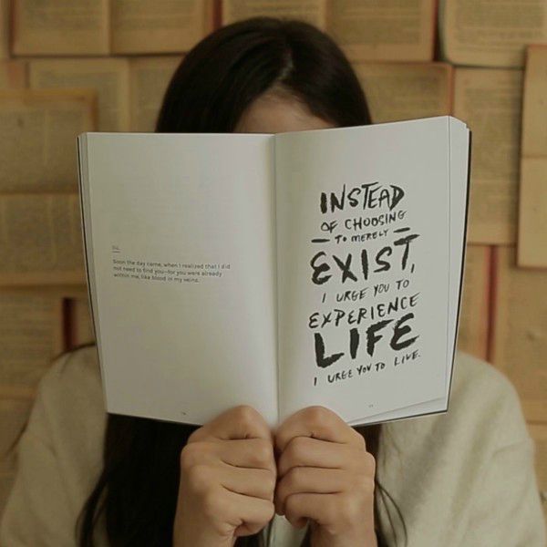 instead of choosing to merely exist i urge you to experience life quote on book woman holding | These 9 Positive Habits Will Make Your Life Better https://positiveroutines.com/positive-habits/