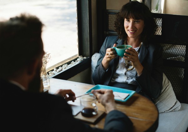 man and woman colleagues at coffee shop | In Time for the Holidays: How to Take Breaks Effectively  https://positiveroutines.com/how-to-take-breaks/