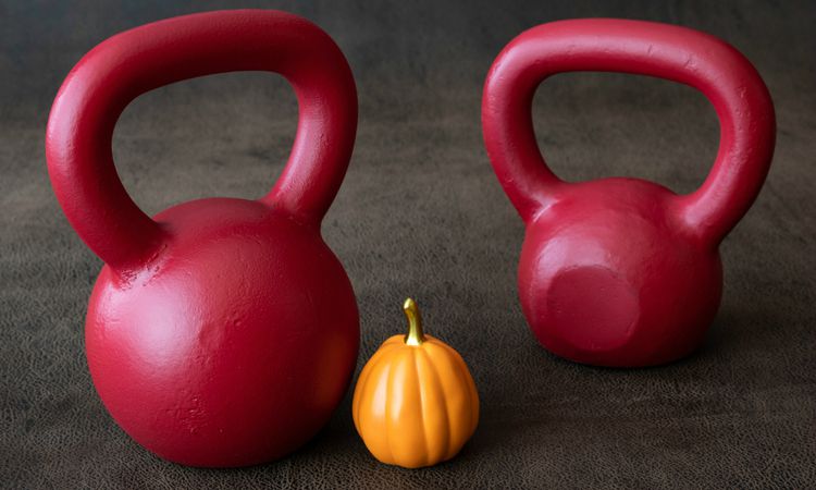 two red kettlebells with mini pumpkin | A Quick and Easy HIIT Routine for Halloween https://positiveroutines.com/easy-hiit-routine/