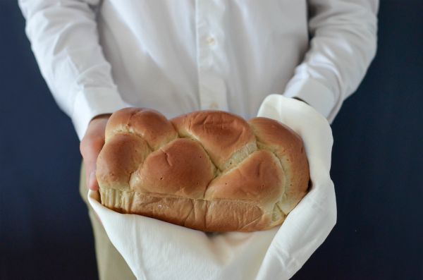 holding fresh loaf of bread | This Is How To Express Gratitude https://positiveroutines.com/express-gratitude/