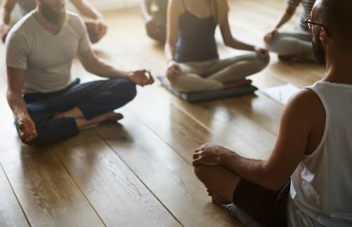 people doing yoga on wooden floor | 67 Healthy Mind and Body Tips to Last You All Winter https://positiveroutines.com/healthy-mind-and-body-tips/