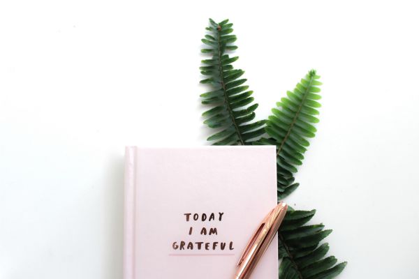 pink journal that says today i am grateful | How to Practice Gratitude With Us This November  https://positiveroutines.com/practice-gratitude/