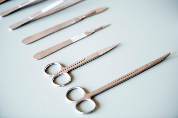surgical scissors against blue background | What Are Binaural Beats + Can They Boost Productivity? https://positiveroutines.com/what-are-binaural-beats/ ‎