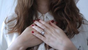 woman holding hands over heart | 5 Simple Steps to Feeling Grateful Right Now https://positiveroutines.com/feeling-grateful/