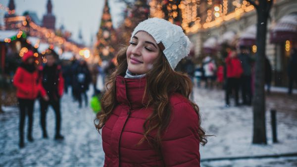woman in red parka smiling against winter scene | [Video] This is the Gratitude Meditation You Need This Fall  https://positiveroutines.com/gratitude-meditation/