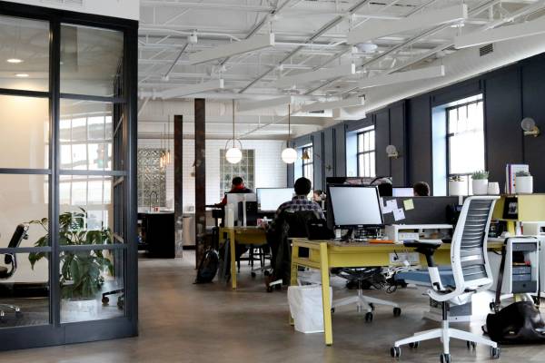modern open office space | 9 Ways to Improve Focus in a Distracted Environment https://positiveroutines.com/improve-focus/